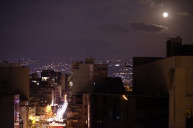 Full moon over Ashrafieh casting a purple haze over the city